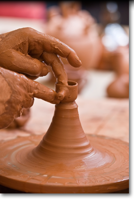 hand shaping pottery